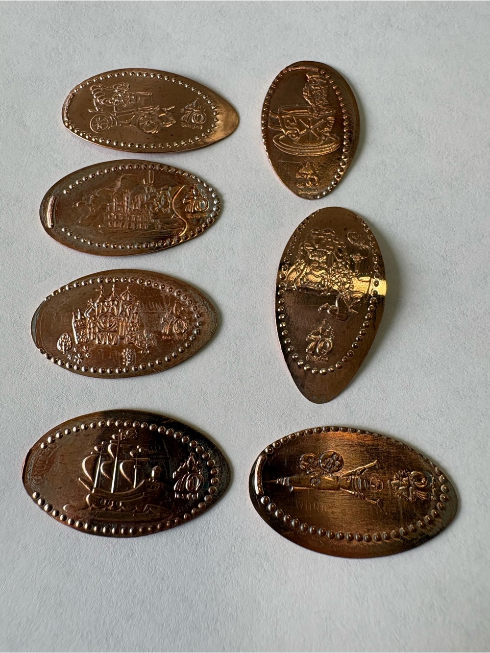 Set of 7 Disneyland 70th Anniversary Pressed Pennies.